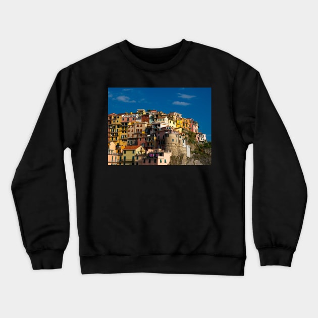 View on the cliff town of Manarola, one of the colorful Cinque Terre on the Italian west coast Crewneck Sweatshirt by Dolfilms
